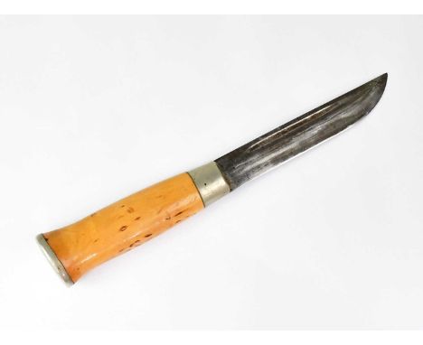A Finnish pukko hunting knife with 5" single edged fullered blade and wooden grip, with leather sheath with pressed decoratio