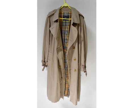 BURBERRY; a tan overcoat with tartan lining, size 50 regular.Condition Report: Overall good condition, small mark to right an