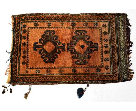 An Irani Turkoman hand-knotted cushion cover in muted colours, 100 x 61cm.