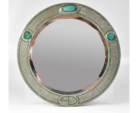 An Arts &amp; Crafts pewter framed circular mirror set with three Ruskin-style glazed ceramic cabochons, diameter 45cm, appar