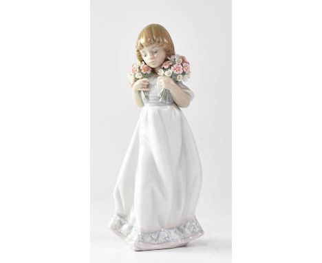 LLADRÓ; three Collectors' Society figures, comprising a 1987 figure of a young girl holding a bunch of flowers, height 20cm, 