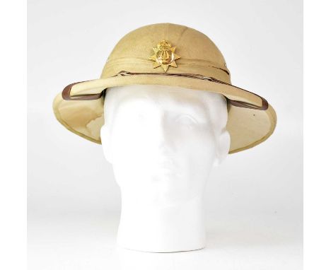 A WWI pith helmet with Army Bandsman cap badge attached.