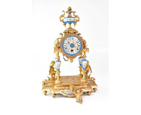 A 19th century French gilt metal mantel clock, the Sèvres-style porcelain dial set with Roman numerals, pendulum with putti o