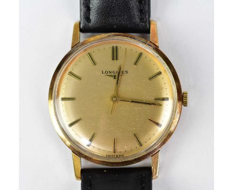 LONGINES; a 9ct gold cased gentlemen's manual wind wristwatch, the champagne dial set with batons and fitted with later assoc