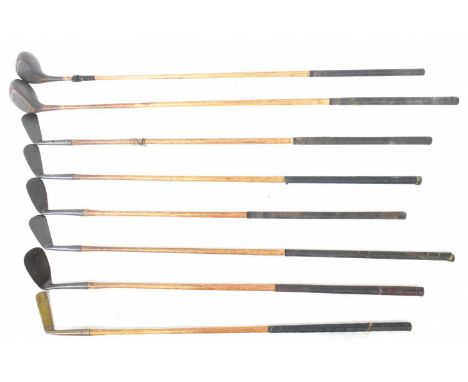 Eight vintage golf clubs to include a Zenith, a cleek, a Maxwell driving iron, a putter, a Finnegan's Special Iron (L), an H.