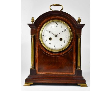 An Edwardian mahogany dome top mantel clock, the enamelled dial set with Arabic numerals, with French La Boname movement stri
