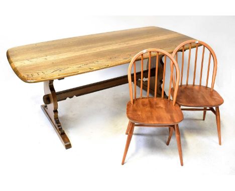 ERCOL; a refectory dining table, 72 x 182 x 88cm, and six stick-back dining chairs (7).Condition Report: The dining table has