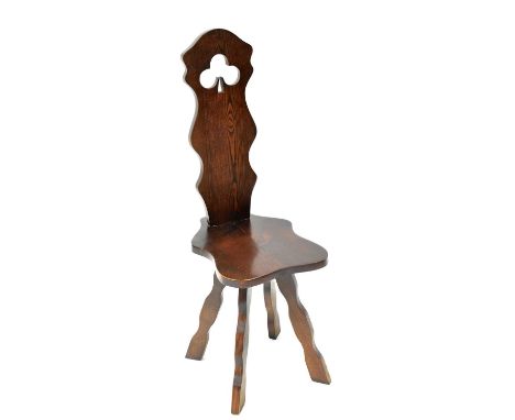 A 20th century elm spinning chair with pierced clover leaf decoration to the seat back, height 93cm.Condition Report: Has rec