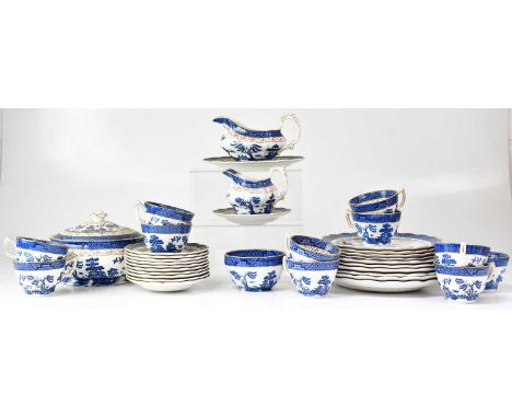 A Booths 'Real Old Willow' part tea and dinner service comprising cups, saucers, plates, sauce boat, milk jug, covered tureen