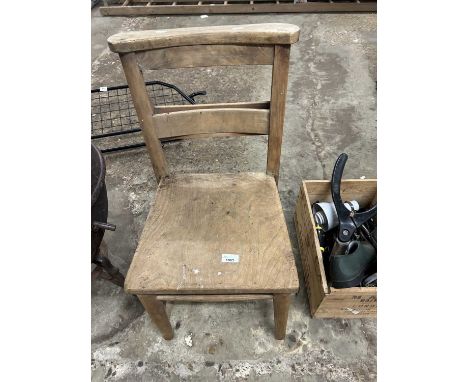 A wooden Church chair together with a box of hand tools
