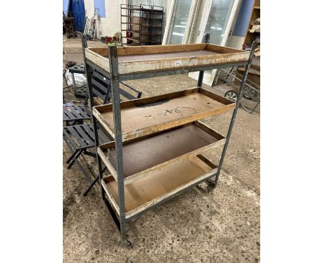 A vintage workshop storage rack on casters