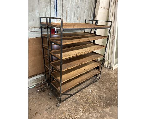 Two large vintage workshop storage racks on casters