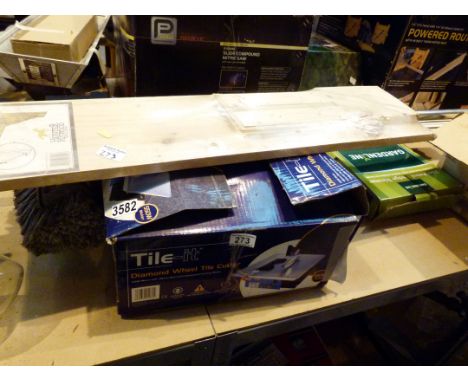 Tile it diamond wheel electric tile cutter, pine shelf, hose fed window brush and a quantity of tile edging