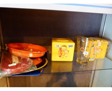 Shelf of pub related items, advertising tin trays, ice buckets and a Bacardi rum jug