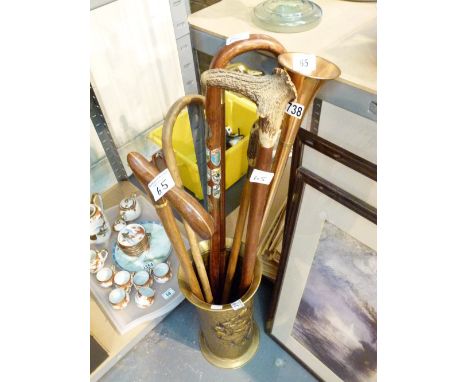 Brass stick stand with six walking sticks and a copper hunting horn