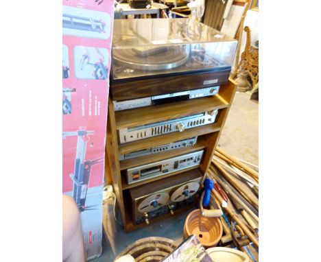 Stereo tower system, including record deck, amplifier and reel to reel tape recorder