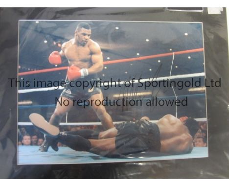 MIKE TYSON AUTOGRAPH    Signed and mounted 20" X 16" colour picture of Mike Tyson in the ring. Generally good