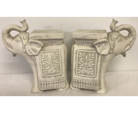 A pair of ceramic elephant pot stands.  Height approx 33cm