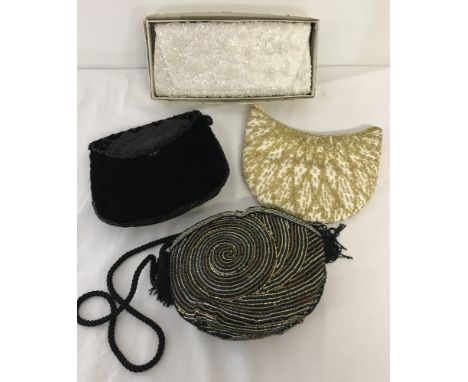 4 vintage heavily beaded evening bags to include one in original box.  
