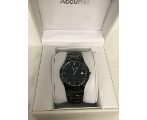 A men's boxed Accurist black ceramic strap wristwatch. With seconds hand and date function. Working order. 