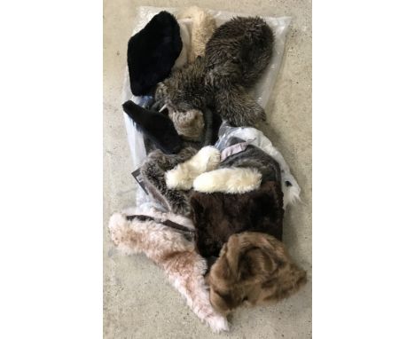 A quantity of assorted vintage and modern ladies faux fur hats, collars and muffs.  