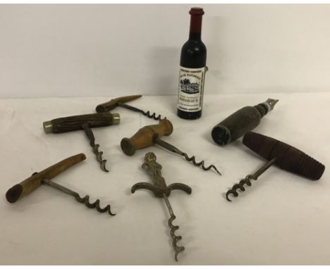 A collection of vintage bottle openers. To include a "Black &amp; White" Buchanans Old Scotch Whisky bottle opener, and horn 