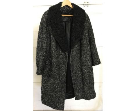 A ladies vintage Sketchlin of London fully lined black and white coat with astrakhan collar.  