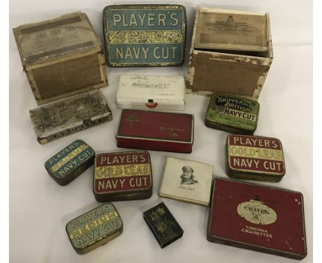 A box of vintage cigarette tins and retailer's wooden snuff boxes.  