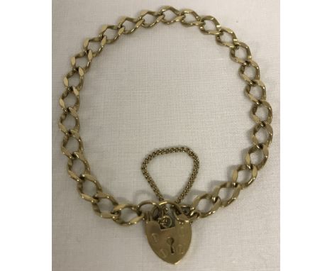 A 9ct gold traditional charm bracelet complete with safety chain.  Approx. 8g.