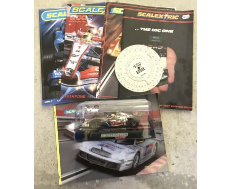A boxed Scalextric C2880 McLaren MP4-21 Lewis Hamilton F1 car, Scalextric Club edition. Together with 5 scalextric catalogues