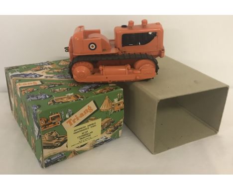 A boxed Tri-ang M121 Caterpillar Tractor. Advanced Airfield Maintenance Wing. With box and outer cardboard sleeve. 