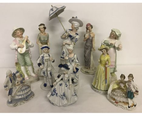 A collection of vintage ceramic and resin figurines.  Largest approx. 32.5cm tall.