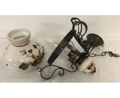 A vintage ceramic 1970s electric lamp. With ceramic shade in tones of brown and metal wall mounting Height approx 40cm, dia. 