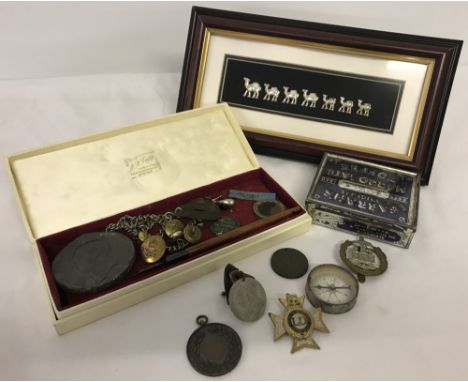 A collection of mixed items. To include military buttons, sports awards and a vintage compass. 