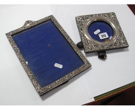 A Hallmarked Silver Mounted Photograph Frame, detailed in relief, on easel back, together with another example. 