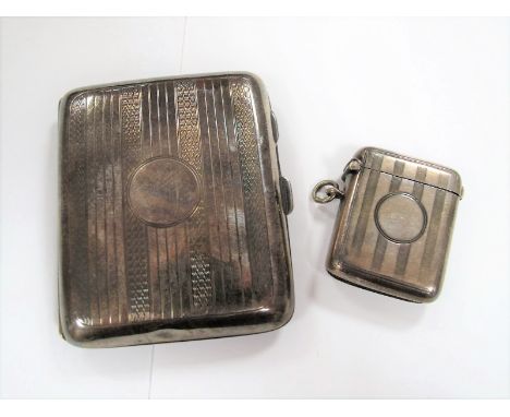 A Silver Cigarette Case, Birmingham 1921, cushioned rectangular form, engine turned decoration with blank circular cartouche,