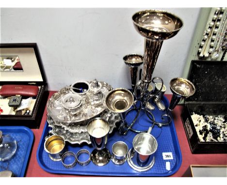 Quantity of Electroplated Wares, including M & Co. epergne of four flutes, condiment set with lion mask pad feet and blue gla