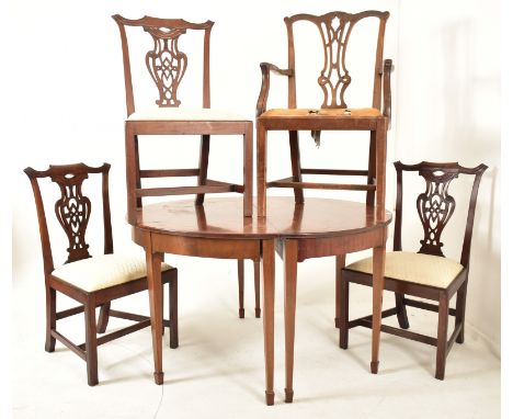 A 19th century George III mahogany extending D-end table with and four chairs. The table having two demi-lune ends raised on 