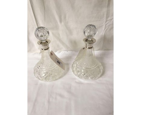  Sale Item:    2 SILVER TOPPED DECANTERS   Vat Status:   No Vat   Buyers Premium:  This lot is subject to a Buyers Premium of