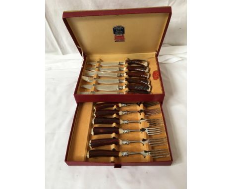  Sale Item:    BOXED SET HORN HANDLED KNIVES &amp; FORKS  Vat Status:   No Vat   Buyers Premium:  This lot is subject to a Bu