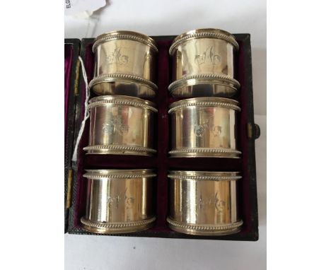  Sale Item:    CASED SET 6 SILVER NAPKIN RINGS   Vat Status:   No Vat   Buyers Premium:  This lot is subject to a Buyers Prem