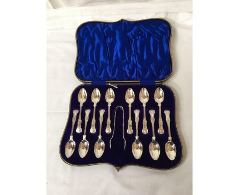 Sale Item:    CASED SET 12 SILVER TEASPOONS &amp; TONGS  Vat Status:   No Vat   Buyers Premium:  This lot is subject to a Bu
