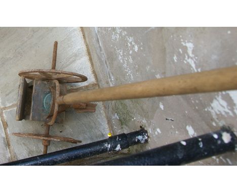 Hand pushed seed drill