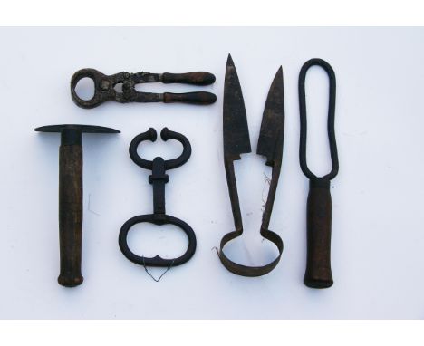 A collection of old agrcultural tools.