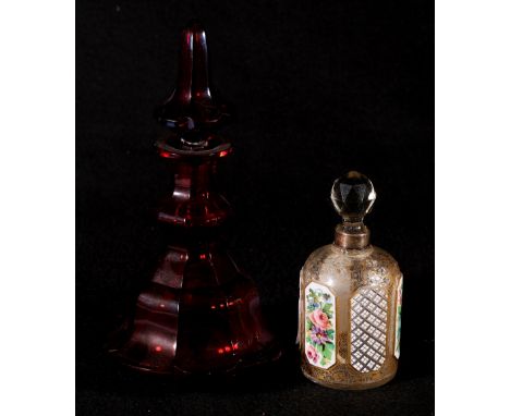 19th Century Bohemian enamel overlaid glass scent bottle, 14cm and a ruby faceted glass spirit decanter.