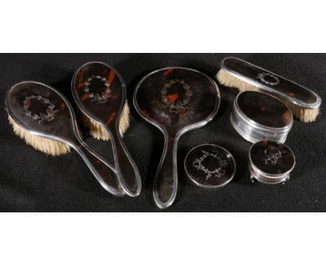 Four piece silver and tortoiseshell piqué work dressing table set, an oval ring box, maker William Comyns, a ring box and toi