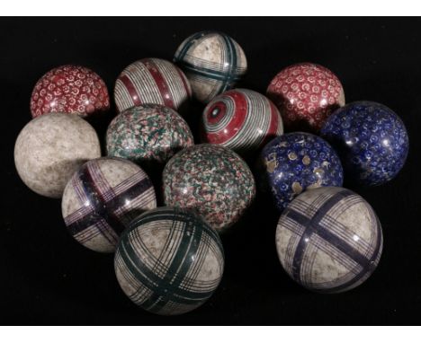 Set of twelve Wemyss carpet bowls, and a jack. CONDITION REPORT: Some damage to glaze.