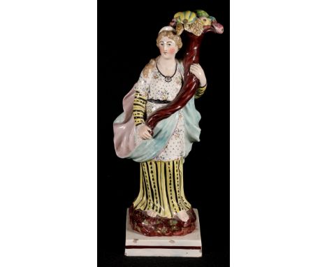 Early 19th century Staffordshire pearl ware figure of Ceres, holding aloft a cornucopia of fruit, 28cm high. CONDITION REPORT