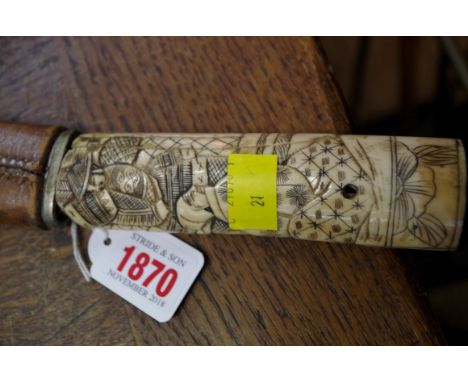 A Japanese bone handle katana and leather scabbard. 