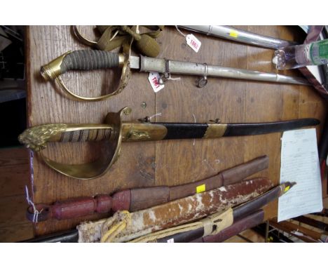 A Royal Navy 1827 pattern cutlass, in leather scabbard inscribed 'W C Cox, Devonport', blade 80cm. 